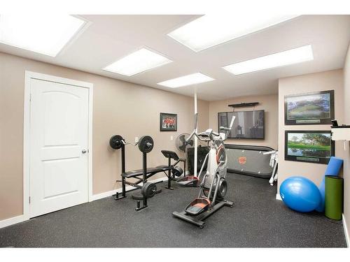 78 Gleneagles Close, Cochrane, AB - Indoor Photo Showing Gym Room