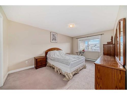 2214-211 Aspen Stone Boulevard Sw, Calgary, AB - Indoor Photo Showing Bedroom