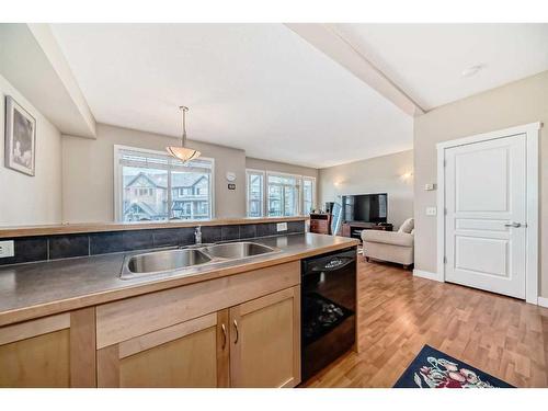 2214-211 Aspen Stone Boulevard Sw, Calgary, AB - Indoor Photo Showing Kitchen With Double Sink