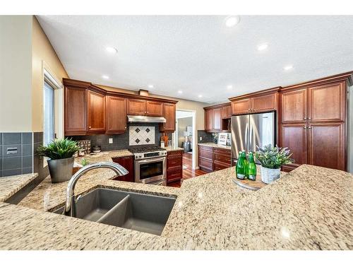 105 Candle Place Sw, Calgary, AB - Indoor Photo Showing Kitchen With Double Sink