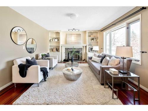 105 Candle Place Sw, Calgary, AB - Indoor Photo Showing Living Room With Fireplace