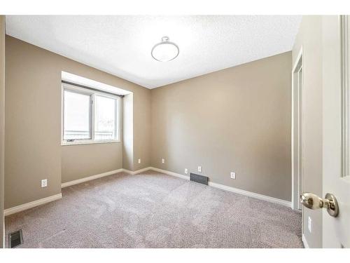 105 Candle Place Sw, Calgary, AB - Indoor Photo Showing Other Room