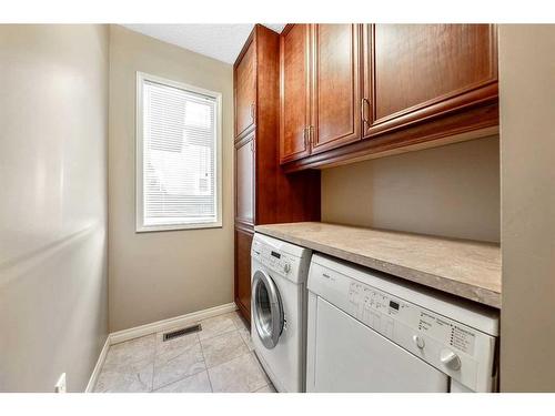 105 Candle Place Sw, Calgary, AB - Indoor Photo Showing Laundry Room