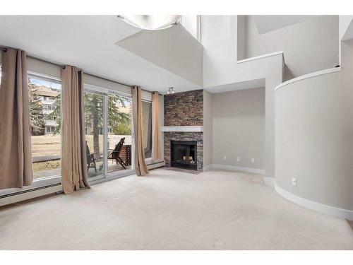 9-211 Village Terrace Sw, Calgary, AB - Indoor With Fireplace