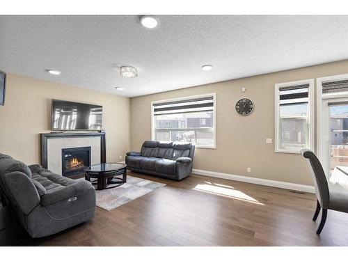 39 Cornerstone Gardens Ne, Calgary, AB - Indoor Photo Showing Living Room With Fireplace