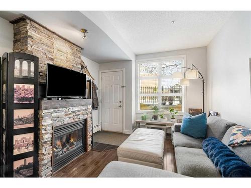 146-315 24 Avenue Sw, Calgary, AB - Indoor Photo Showing Living Room With Fireplace