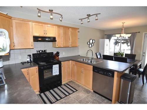 310 Ranch Garden, Strathmore, AB - Indoor Photo Showing Kitchen With Double Sink