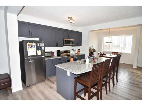 187 Carringham Road Nw, Calgary, AB - Indoor Photo Showing Kitchen With Stainless Steel Kitchen With Double Sink