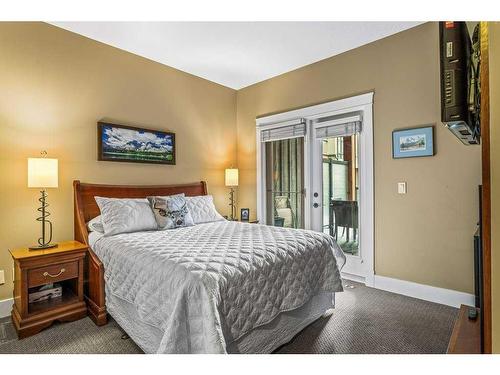 105-187 Kananaskis Way, Canmore, AB - Indoor Photo Showing Bedroom
