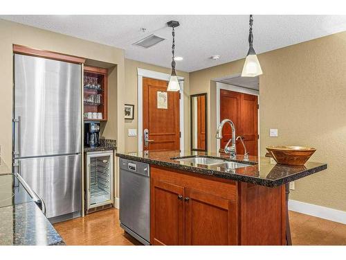 105-187 Kananaskis Way, Canmore, AB - Indoor Photo Showing Kitchen With Double Sink