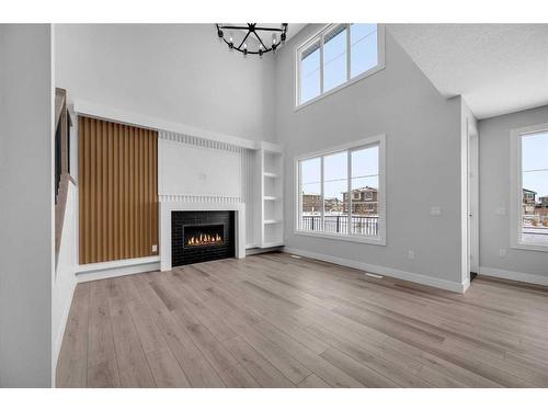 172 Sandpiper Landing, Chestermere, AB - Indoor Photo Showing Living Room With Fireplace