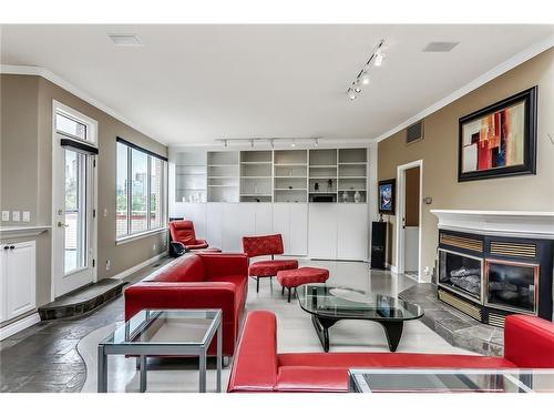 912 Memorial Drive Nw, Calgary, AB - Indoor Photo Showing Living Room With Fireplace