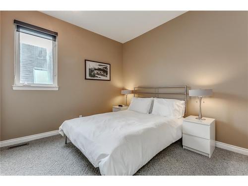 912 Memorial Drive Nw, Calgary, AB - Indoor Photo Showing Bedroom