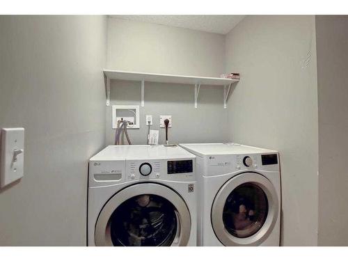 98 Saddleback Road Ne, Calgary, AB - Indoor Photo Showing Laundry Room