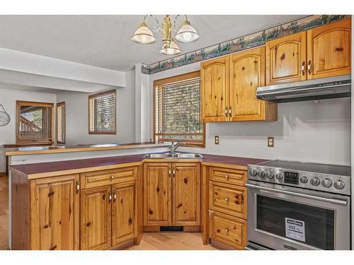17 Ridge Road, Canmore, AB - Indoor Photo Showing Kitchen With Double Sink