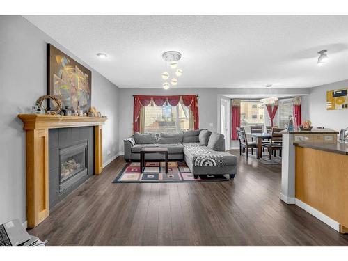 16 Saddlecrest Green Ne, Calgary, AB - Indoor Photo Showing Living Room With Fireplace