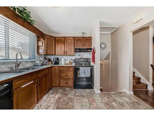 1328 Pennsburg Road Se, Calgary, AB - Indoor Photo Showing Kitchen With Double Sink