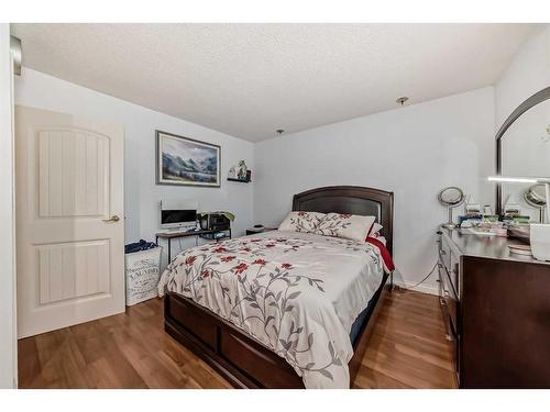 1328 Pennsburg Road Se, Calgary, AB - Indoor Photo Showing Bedroom