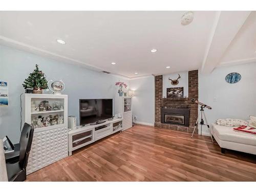 1328 Pennsburg Road Se, Calgary, AB - Indoor Photo Showing Living Room With Fireplace