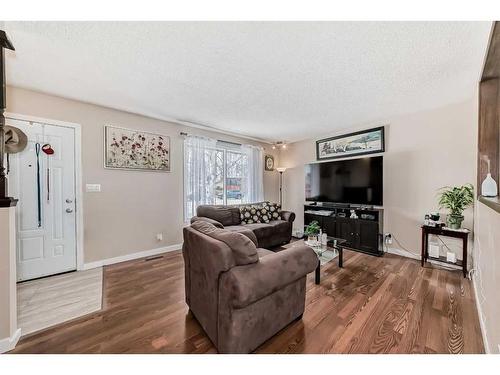 1328 Pennsburg Road Se, Calgary, AB - Indoor Photo Showing Living Room