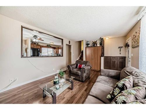 1328 Pennsburg Road Se, Calgary, AB - Indoor Photo Showing Living Room