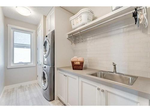142 Waters Edge Drive, Heritage Pointe, AB - Indoor Photo Showing Laundry Room