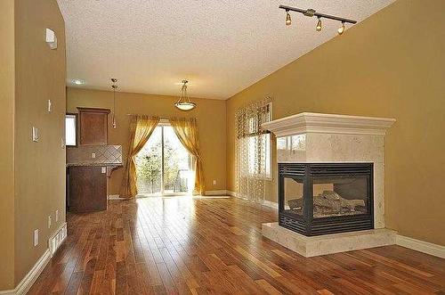 507 17 Avenue Nw, Calgary, AB - Indoor Photo Showing Living Room With Fireplace
