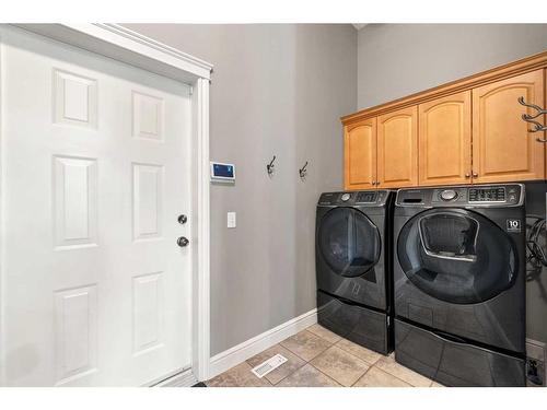 171 Sunterra Ridge Place, Cochrane, AB - Indoor Photo Showing Laundry Room