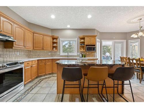 171 Sunterra Ridge Place, Cochrane, AB - Indoor Photo Showing Kitchen With Upgraded Kitchen