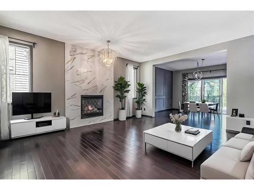 192 Cranford Drive Se, Calgary, AB - Indoor Photo Showing Living Room With Fireplace