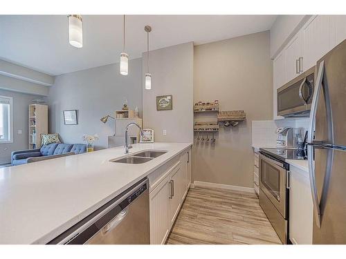 413-20 Mahogany Mews Se, Calgary, AB - Indoor Photo Showing Kitchen With Stainless Steel Kitchen With Double Sink