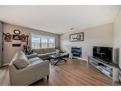 112 Everglen Way Sw, Calgary, AB - Indoor Photo Showing Living Room With Fireplace