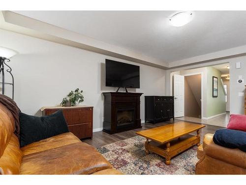 288 Viewpointe Terrace, Chestermere, AB - Indoor Photo Showing Living Room With Fireplace