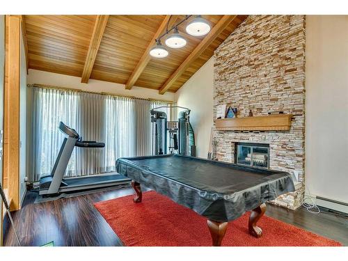115 Lansdown Estates, Rural Rocky View County, AB - Indoor With Fireplace