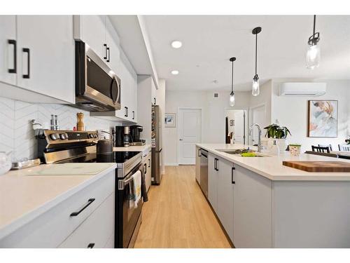 3102-220 Seton Grove Se, Calgary, AB - Indoor Photo Showing Kitchen With Upgraded Kitchen