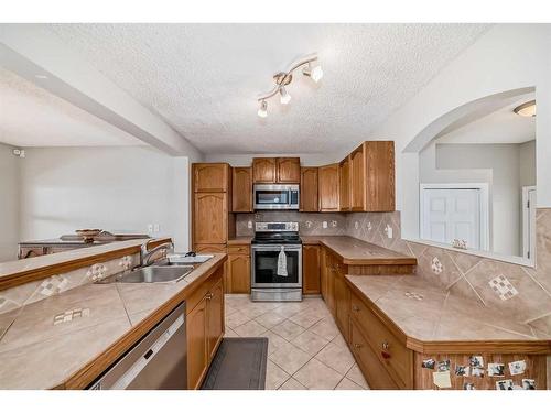 163 Eversyde Circle Sw, Calgary, AB - Indoor Photo Showing Kitchen With Double Sink