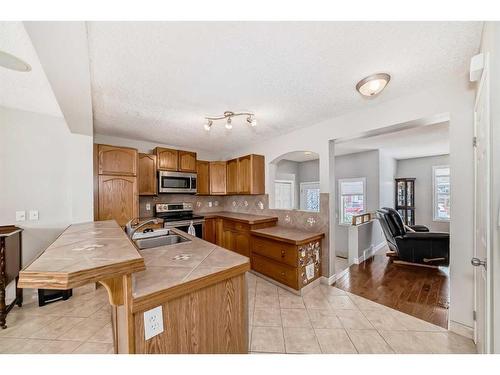 163 Eversyde Circle Sw, Calgary, AB - Indoor Photo Showing Kitchen With Double Sink