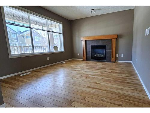 189 Copperstone Terrace Se, Calgary, AB - Indoor Photo Showing Living Room With Fireplace