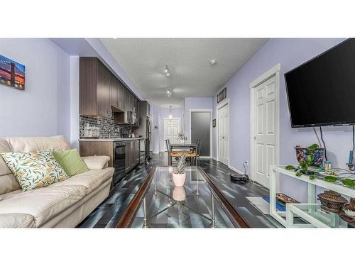 4216-215 Legacy Boulevard Se, Calgary, AB - Indoor Photo Showing Living Room