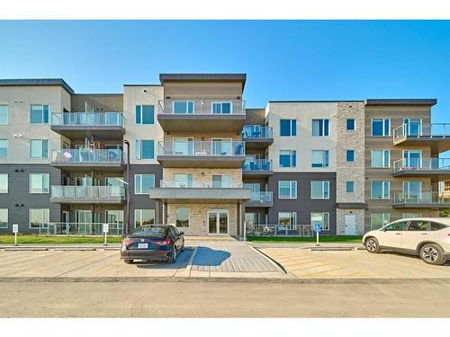 210-200 Shawnee Square Sw, Calgary, AB - Outdoor With Facade