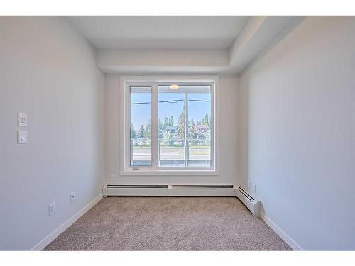 210-200 Shawnee Square Sw, Calgary, AB - Indoor Photo Showing Other Room