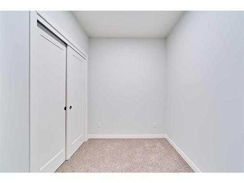 210-200 Shawnee Square Sw, Calgary, AB - Indoor Photo Showing Other Room