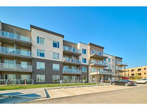 210-200 Shawnee Square Sw, Calgary, AB - Outdoor With Facade