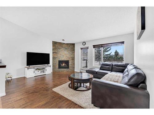 300 Lakeside Greens Crescent, Chestermere, AB - Indoor Photo Showing Living Room With Fireplace