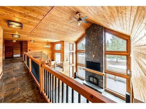 280231 Grand Valley Road, Rural Rocky View County, AB - Indoor Photo Showing Other Room With Fireplace