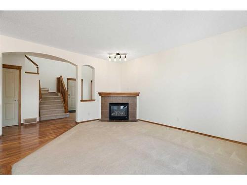 27 Cranfield Circle Se, Calgary, AB - Indoor Photo Showing Living Room With Fireplace
