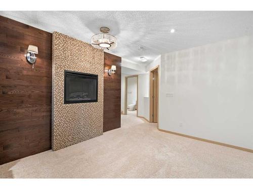 27 Cranfield Circle Se, Calgary, AB - Indoor Photo Showing Other Room With Fireplace