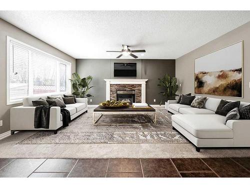 20 Mt Cascade Close Se, Calgary, AB - Indoor Photo Showing Living Room With Fireplace