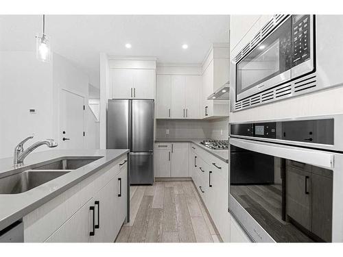 204 Seton Villas Se, Calgary, AB - Indoor Photo Showing Kitchen With Stainless Steel Kitchen With Double Sink