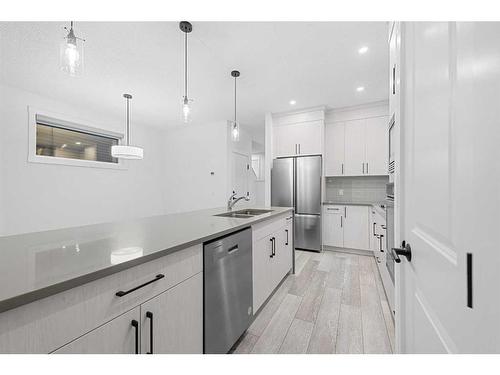 204 Seton Villas Se, Calgary, AB - Indoor Photo Showing Kitchen With Stainless Steel Kitchen With Double Sink With Upgraded Kitchen